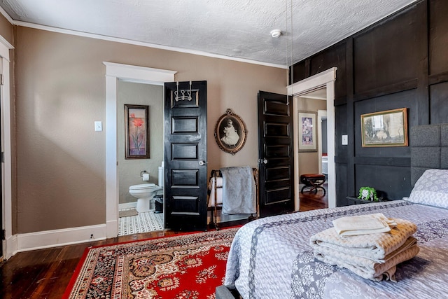 1200 E Walnut St, Springfield, MO 65802 - bedroom with wood finished floors, baseboards, ornamental molding, and connected bathroom