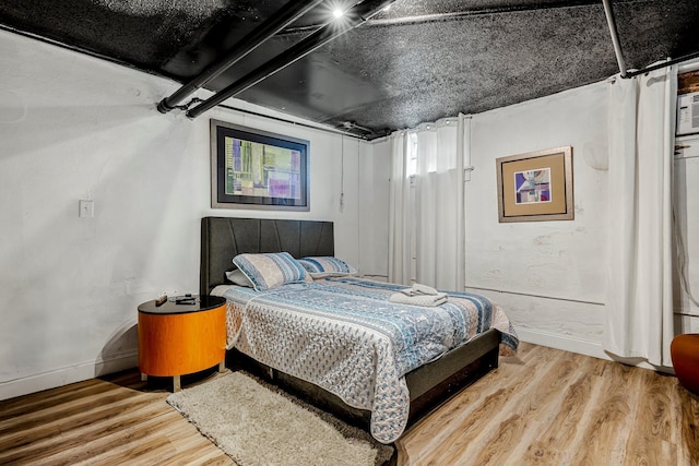 1200 E Walnut St, Springfield, MO 65802 - bedroom featuring baseboards and wood finished floors