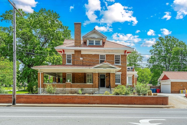1200 E Walnut St, Springfield, MO 65802 - traditional style home featuring a chimney, a porch, and a tile roof