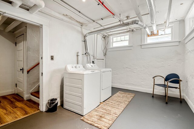 1200 E Walnut St, Springfield, MO 65802 - basement with washing machine and clothes dryer, baseboards, and a textured wall