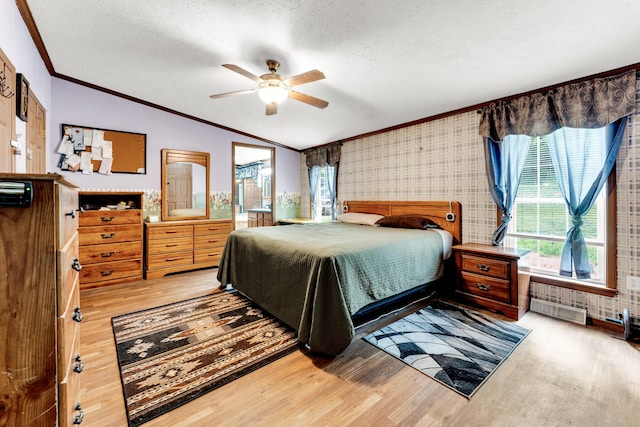 1161 State Highway 176, Rockaway Beach, MO 65740 - bedroom with vaulted ceiling, ornamental molding, wood finished floors, a textured ceiling, and ceiling fan