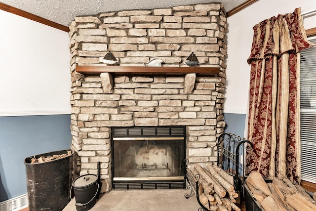 1161 State Highway 176, Rockaway Beach, MO 65740 - detailed view of crown molding, a textured ceiling, and a stone fireplace