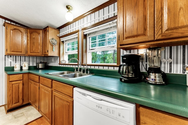 1161 State Highway 176, Rockaway Beach, MO 65740 - kitchen featuring dishwasher, a sink, brown cabinetry, a textured ceiling, and crown molding