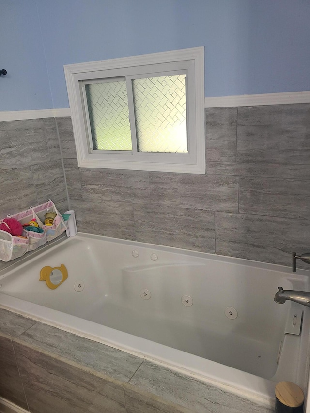 511 3rd St, Mccune, MO 66753 - bathroom featuring a tub with jets