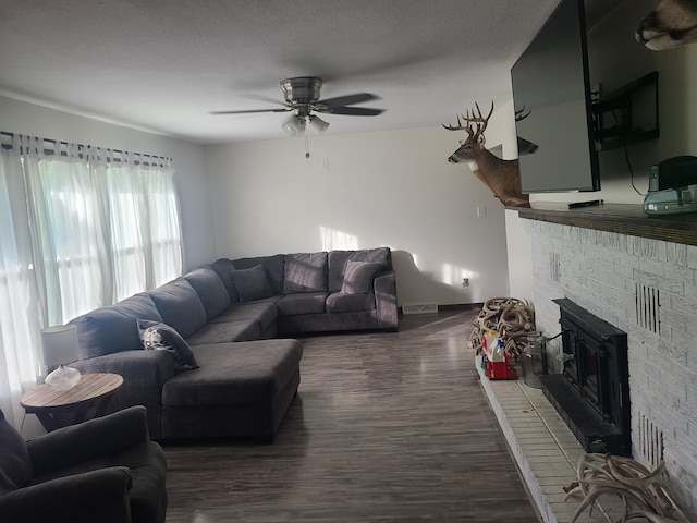 511 3rd St, Mccune, MO 66753 - living room with ceiling fan, dark wood-style flooring, and baseboards