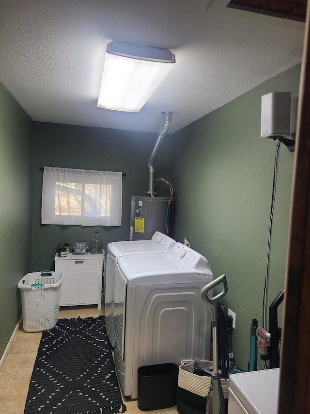 511 3rd St, Mccune, MO 66753 - laundry room featuring independent washer and dryer, electric water heater, and a textured ceiling