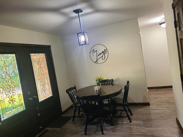 511 3rd St, Mccune, MO 66753 - dining space featuring wood finished floors and baseboards