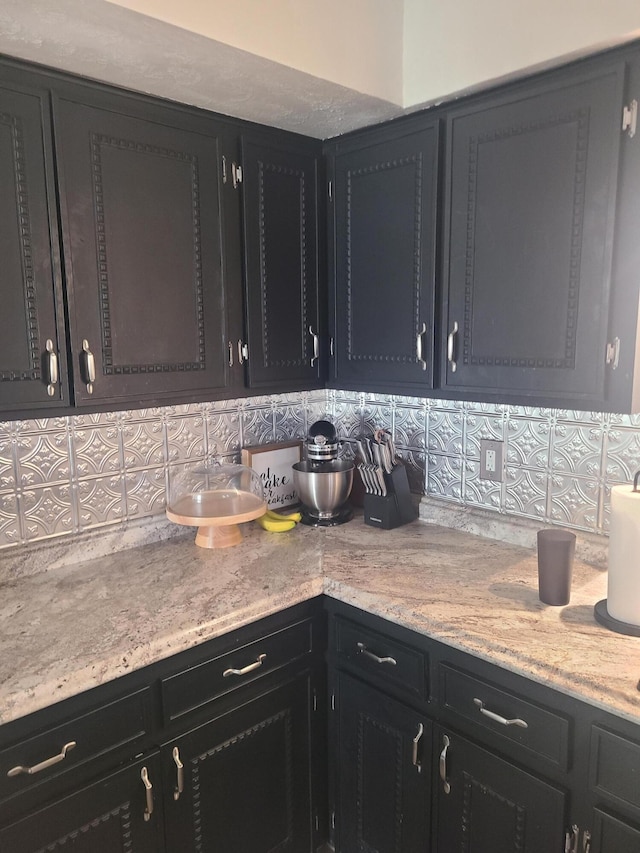 511 3rd St, Mccune, MO 66753 - kitchen with decorative backsplash and dark cabinetry