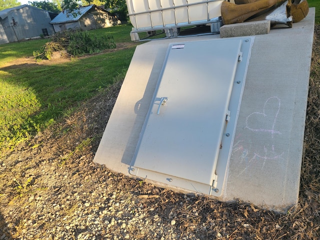 511 3rd St, Mccune, MO 66753 - view of storm shelter with a yard