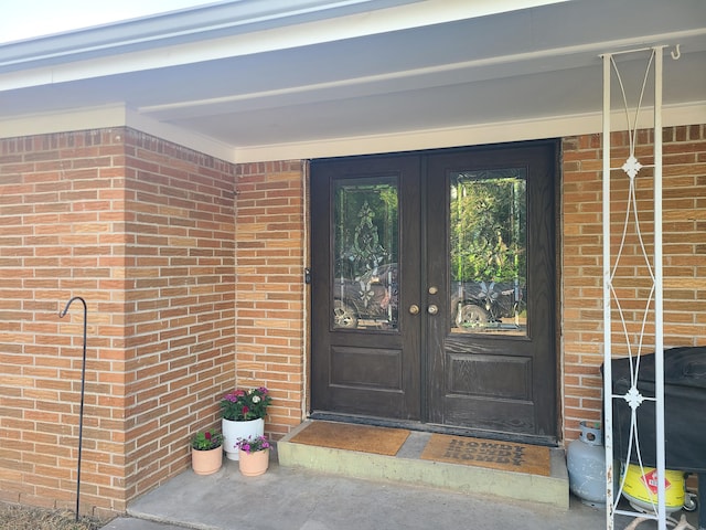 511 3rd St, Mccune, MO 66753 - property entrance with french doors and brick siding