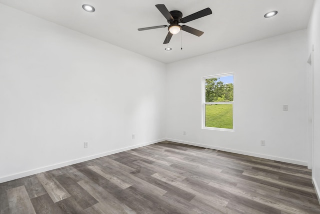 806 Iris Ave, Crane, MO 65633 - empty room with dark wood-style flooring, ceiling fan, recessed lighting, and baseboards