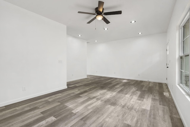 806 Iris Ave, Crane, MO 65633 - spare room with ceiling fan, recessed lighting, wood finished floors, and baseboards