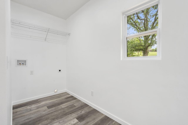 806 Iris Ave, Crane, MO 65633 - washroom with electric dryer hookup, dark wood-style flooring, washer hookup, and baseboards