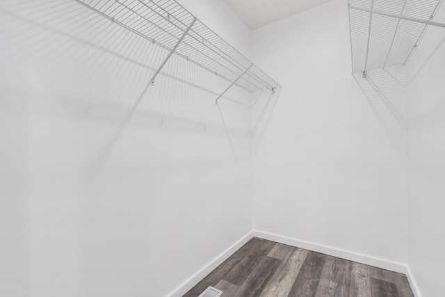 806 Iris Ave, Crane, MO 65633 - spacious closet with dark wood-type flooring