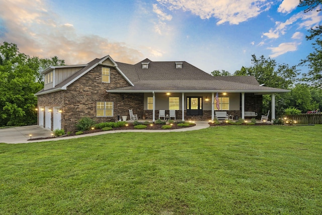 4936 S Butterfield Pl, Brookline, MO 65619 - view of front facade featuring covered porch, driveway, brick siding, roof with shingles, and a garage