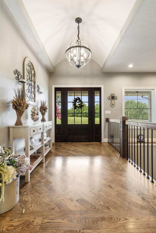 4936 S Butterfield Pl, Brookline, MO 65619 - entrance foyer with a chandelier, vaulted ceiling, healthy amount of natural light, and wood finished floors