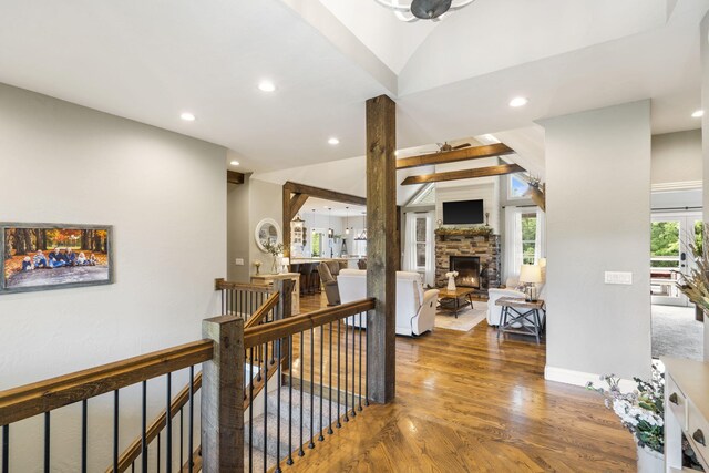 4936 S Butterfield Pl, Brookline, MO 65619 - hallway with an upstairs landing, wood finished floors, recessed lighting, baseboards, and lofted ceiling
