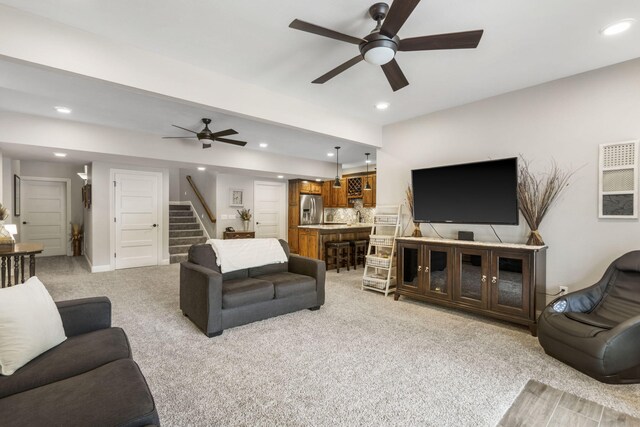 4936 S Butterfield Pl, Brookline, MO 65619 - living area featuring a ceiling fan, stairway, recessed lighting, and light carpet