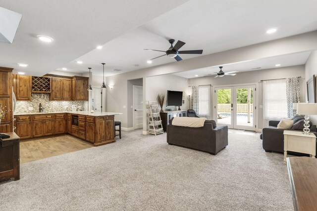 4936 S Butterfield Pl, Brookline, MO 65619 - living area featuring recessed lighting, a ceiling fan, light carpet, and baseboards