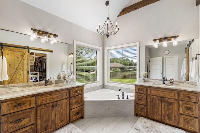 4936 S Butterfield Pl, Brookline, MO 65619 - full bath featuring lofted ceiling, two vanities, a garden tub, a chandelier, and tile patterned floors