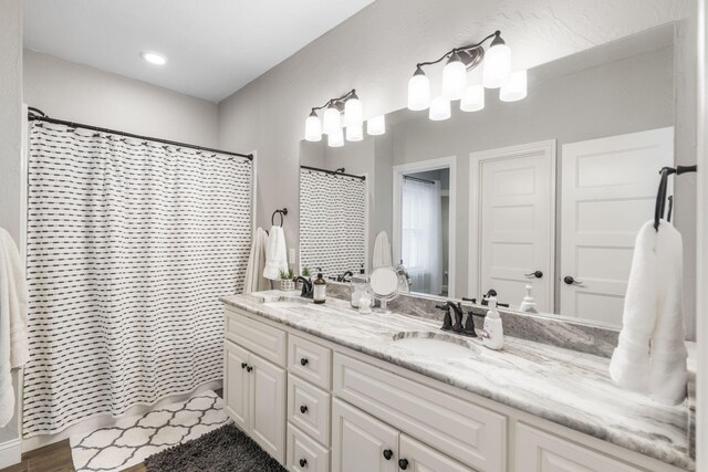 4936 S Butterfield Pl, Brookline, MO 65619 - full bathroom featuring double vanity and a shower with curtain