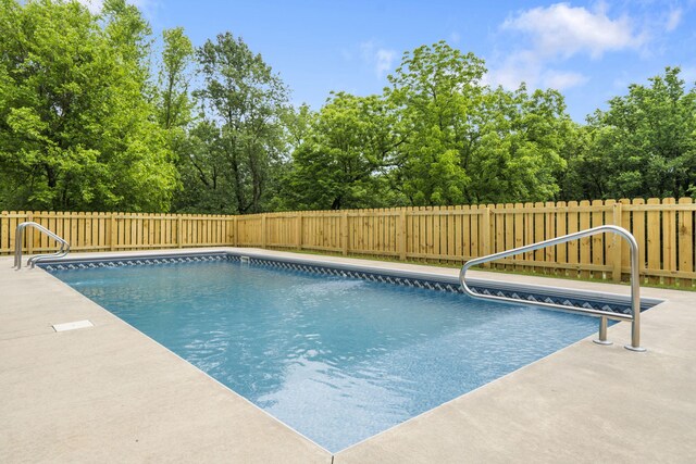4936 S Butterfield Pl, Brookline, MO 65619 - view of swimming pool with a fenced backyard and view of scattered trees