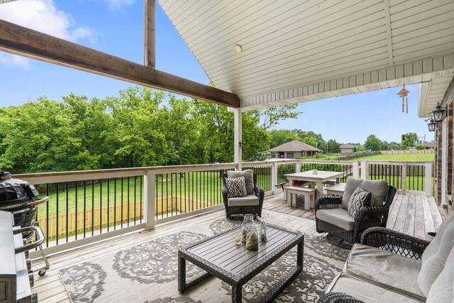 4936 S Butterfield Pl, Brookline, MO 65619 - deck with an outdoor hangout area, a yard, and area for grilling