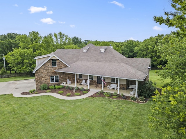 4936 S Butterfield Pl, Brookline, MO 65619 - view of front of house featuring stone siding, a shingled roof, a patio, and board and batten siding