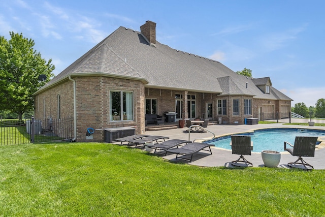 3731 S Farm Rd Unit 219, Rogersville, MO 65742 - back of house featuring brick siding, a patio, a shingled roof, a chimney, and cooling unit