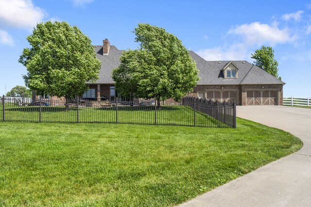 3731 S Farm Rd Unit 219, Rogersville, MO 65742 - view of front of home featuring brick siding, an attached garage, concrete driveway, and roof with shingles
