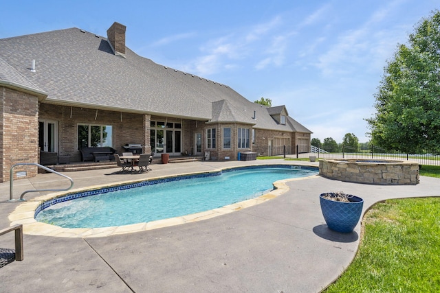 3731 S Farm Rd Unit 219, Rogersville, MO 65742 - view of pool featuring a patio area, a pool with connected hot tub, and central air condition unit