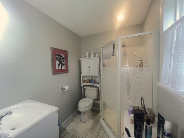 608 N Chapman St, Anderson, MO 64831 - bathroom featuring a stall shower, toilet, and vanity