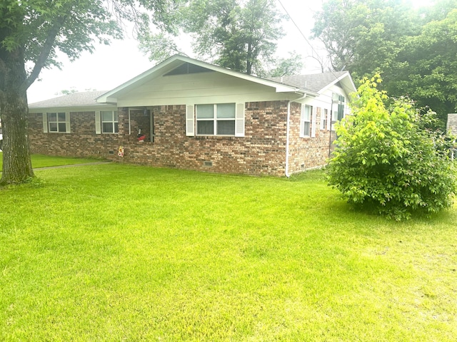 608 N Chapman St, Anderson, MO 64831 - ranch-style house featuring a front lawn, crawl space, and brick siding