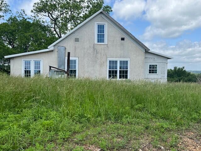 5596 Bado Rd, Cabool, MO 65689 - view of side of property with stucco siding