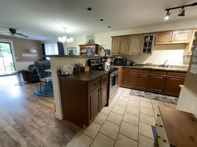 123 River Point Rd Unit 33, Hollister, MO 65672 - kitchen with stainless steel electric stove, a chandelier, healthy amount of natural light, and a peninsula