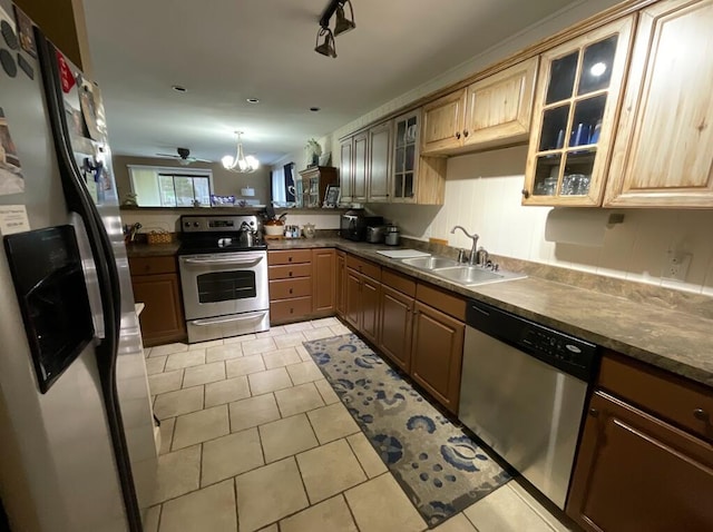 123 River Point Rd Unit 33, Hollister, MO 65672 - kitchen with stainless steel appliances, a sink, dark countertops, glass insert cabinets, and light tile patterned flooring