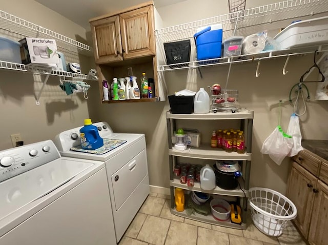 123 River Point Rd Unit 33, Hollister, MO 65672 - laundry area featuring washing machine and clothes dryer, baseboards, and light tile patterned flooring