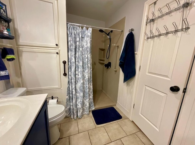 123 River Point Rd Unit 33, Hollister, MO 65672 - bathroom with toilet, a stall shower, tile patterned flooring, and vanity