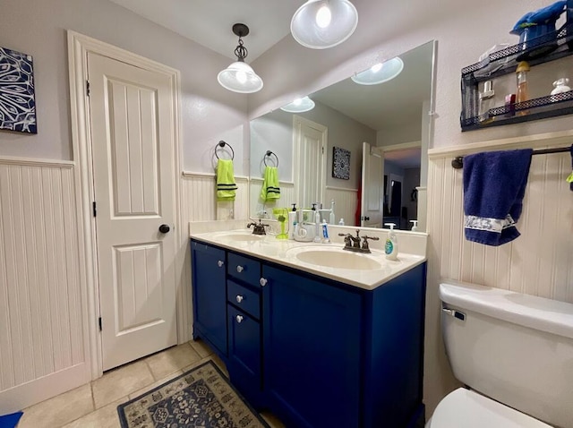 123 River Point Rd Unit 33, Hollister, MO 65672 - full bathroom with a wainscoted wall, toilet, tile patterned floors, and double vanity