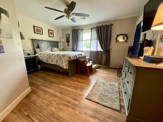 123 River Point Rd Unit 33, Hollister, MO 65672 - bedroom featuring light wood-style floors, ceiling fan, and baseboards