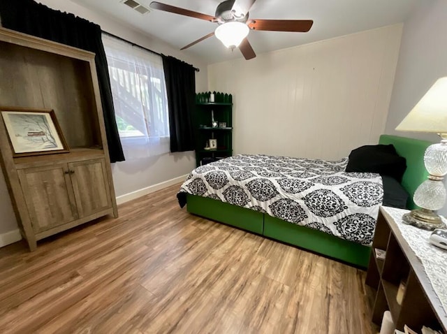 123 River Point Rd Unit 33, Hollister, MO 65672 - bedroom featuring light wood finished floors, baseboards, and ceiling fan