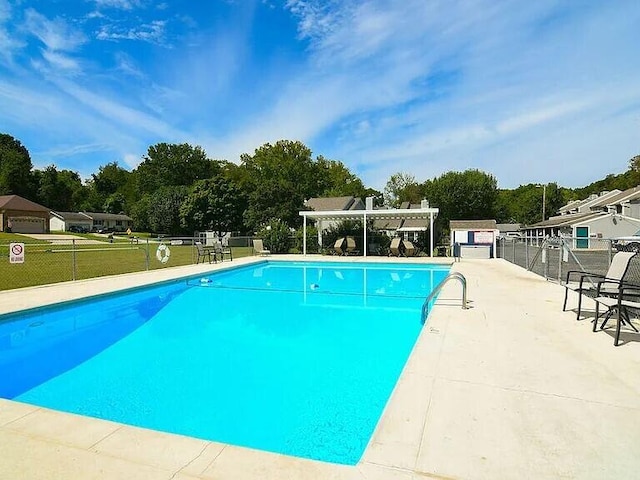 123 River Point Rd Unit 33, Hollister, MO 65672 - community pool featuring a pergola and view of scattered trees