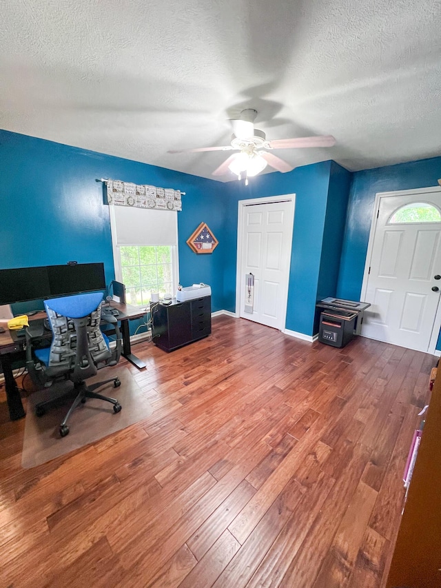 21650 Kings Loop, Hermitage, MO 65668 - office area with a textured ceiling, wood finished floors, ceiling fan, and baseboards