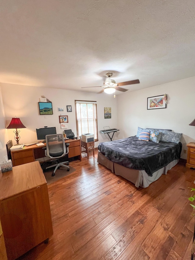 21650 Kings Loop, Hermitage, MO 65668 - bedroom featuring wood-type flooring, a desk, and a ceiling fan