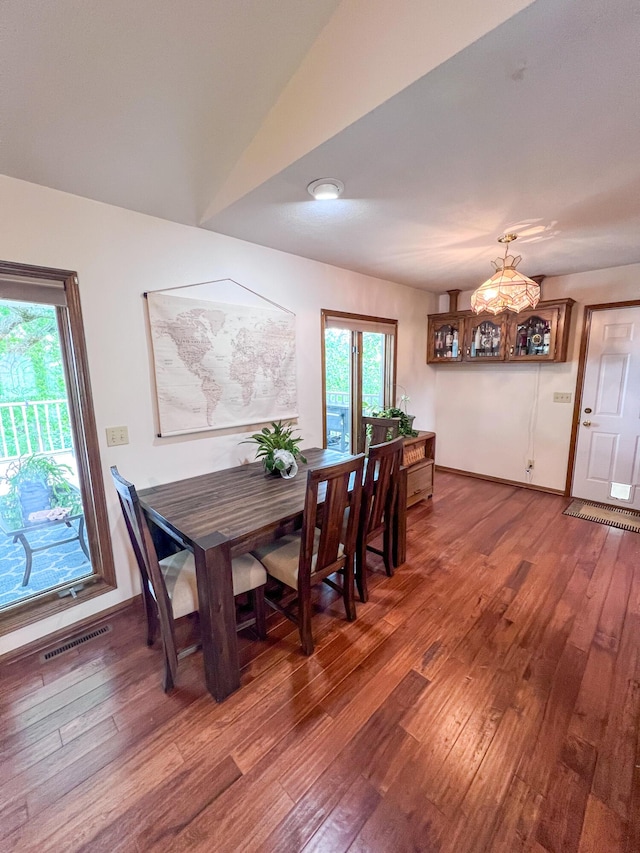 21650 Kings Loop, Hermitage, MO 65668 - dining room featuring hardwood / wood-style flooring, healthy amount of natural light, and a chandelier