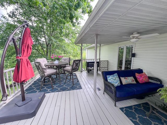 21650 Kings Loop, Hermitage, MO 65668 - wooden deck featuring outdoor dining space, an outdoor living space, and ceiling fan
