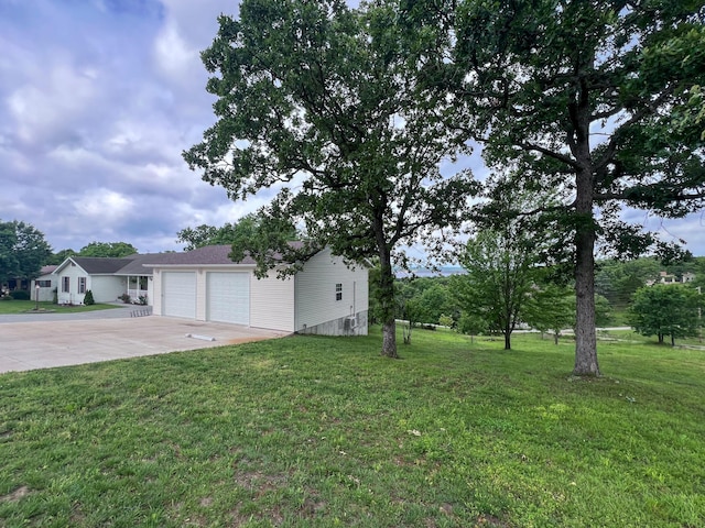 21650 Kings Loop, Hermitage, MO 65668 - view of green lawn featuring concrete driveway and an attached garage