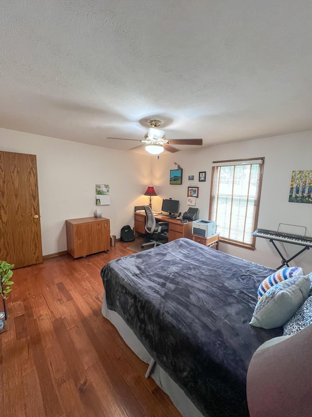 21650 Kings Loop, Hermitage, MO 65668 - bedroom featuring wood finished floors, an office area, and ceiling fan