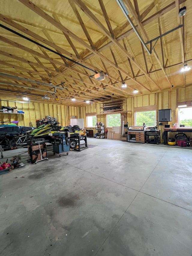 21650 Kings Loop, Hermitage, MO 65668 - garage with a garage door opener and a workshop area