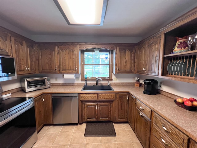 21650 Kings Loop, Hermitage, MO 65668 - kitchen featuring stainless steel appliances, a sink, light tile patterned flooring, and light countertops